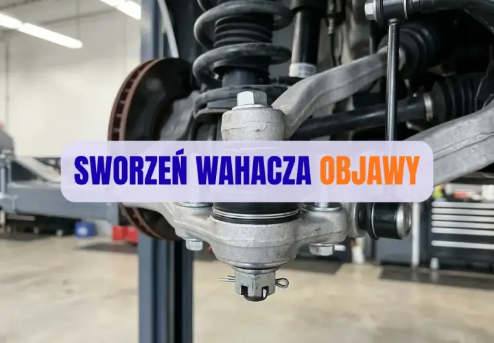 Wymiana sworznia wahacza. Widok na zawieszenie samochodu z widocznym sworzniem wahacza, gotowym do wymiany.